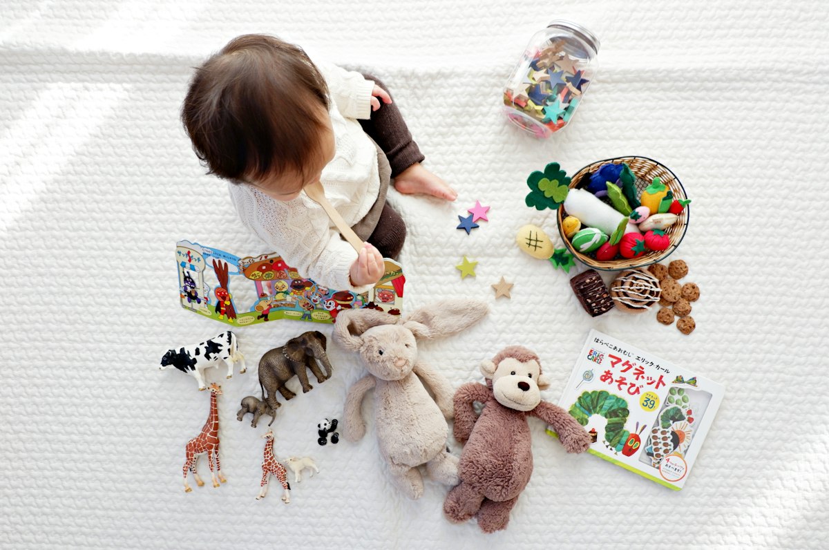 Child exploring colorful creative toys